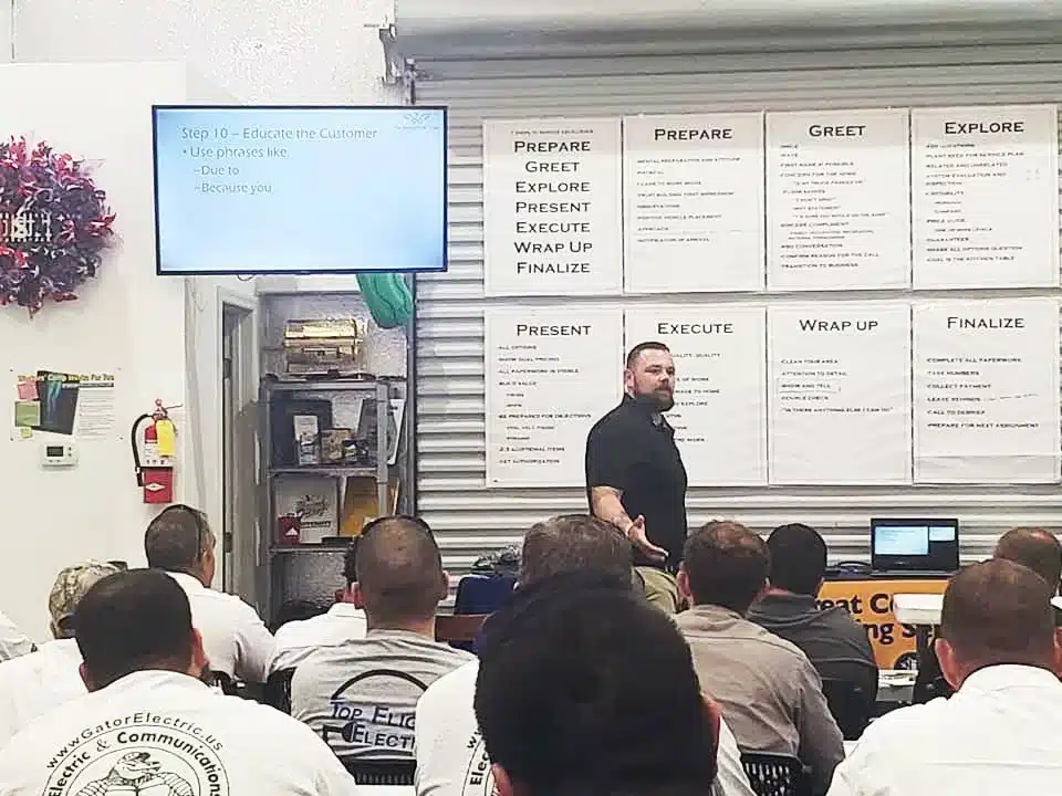The Service Profit Group's consultant, Darren George, addressing a room of technicians and members at an on-site at their shop