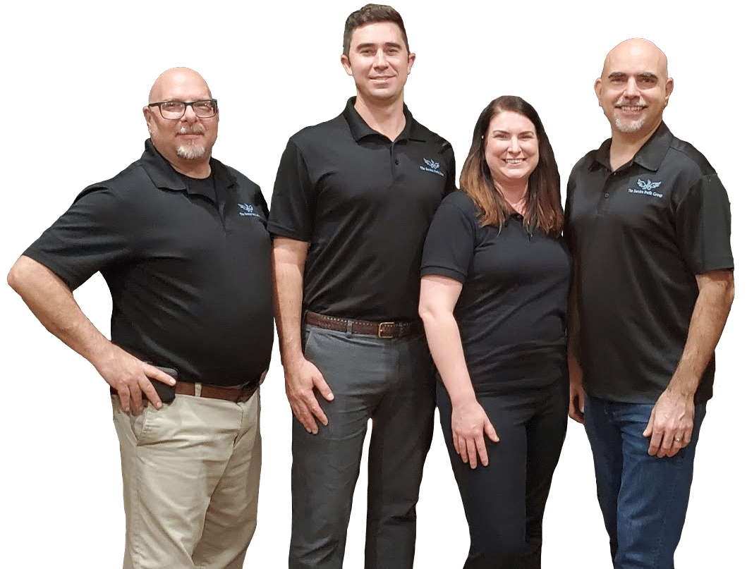 3 of The Service Profit Group's employees, standing in black SPG polo shirts smiling. Senior consultant, Drew Melamed, and consultant Darren George standing with arms crossed on either side of Joe O'Grady with his arms out